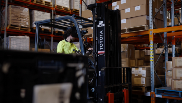 Forklift operates in a warehouse